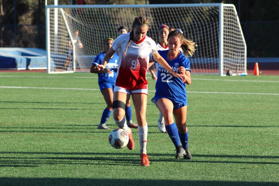Freshman Christine Goodman, Forward, dribbles the ball away from her opponent during their game against Chaminade Hawaii University on October 31, 2019. 