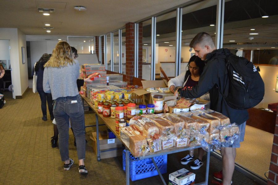 Students stop by the Pop-Up Pantry located in the Student Union Building every Tuesday in order to pick up groceries. 