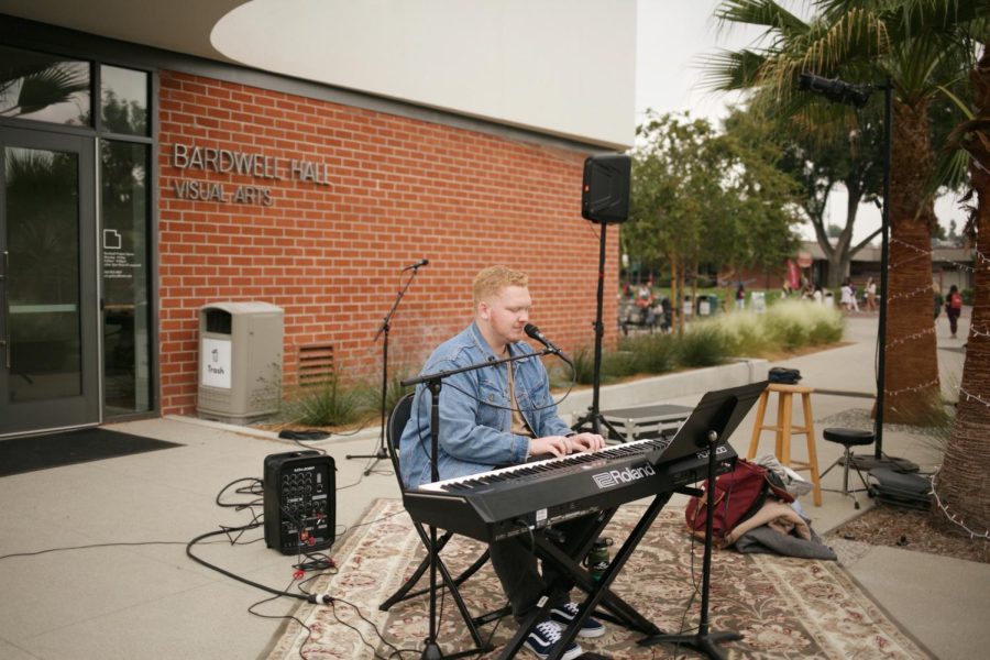 Student Jospeh Hall displays his musical talents at the student singer/songwriter showcase.