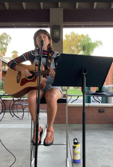 Senior music therapy major Daisy Perrigan performs an original composition at the concert. 