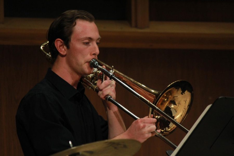 Music composition major Jason Rhue plays a piece on the trombone.