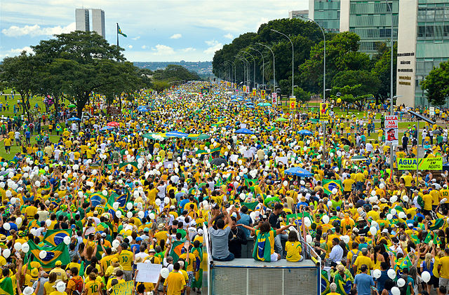 Protestors%2C+many+clad+in+the+yellow+soccer+jerseys+of+Brazils+national+team%2C+descend+on+the+nations+capital.