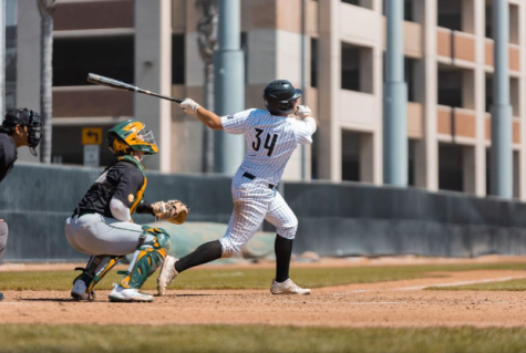 Sophomore catcher Sam Lisiak crushes a pitch. 