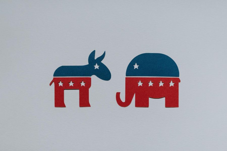 The+Democrat+and+Republican+parties+face+a+widening+divide.