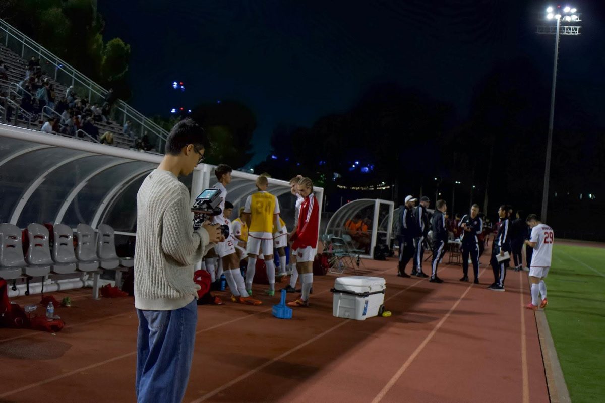 Jonathan Kim pictured left films Biola Men’s soccer team