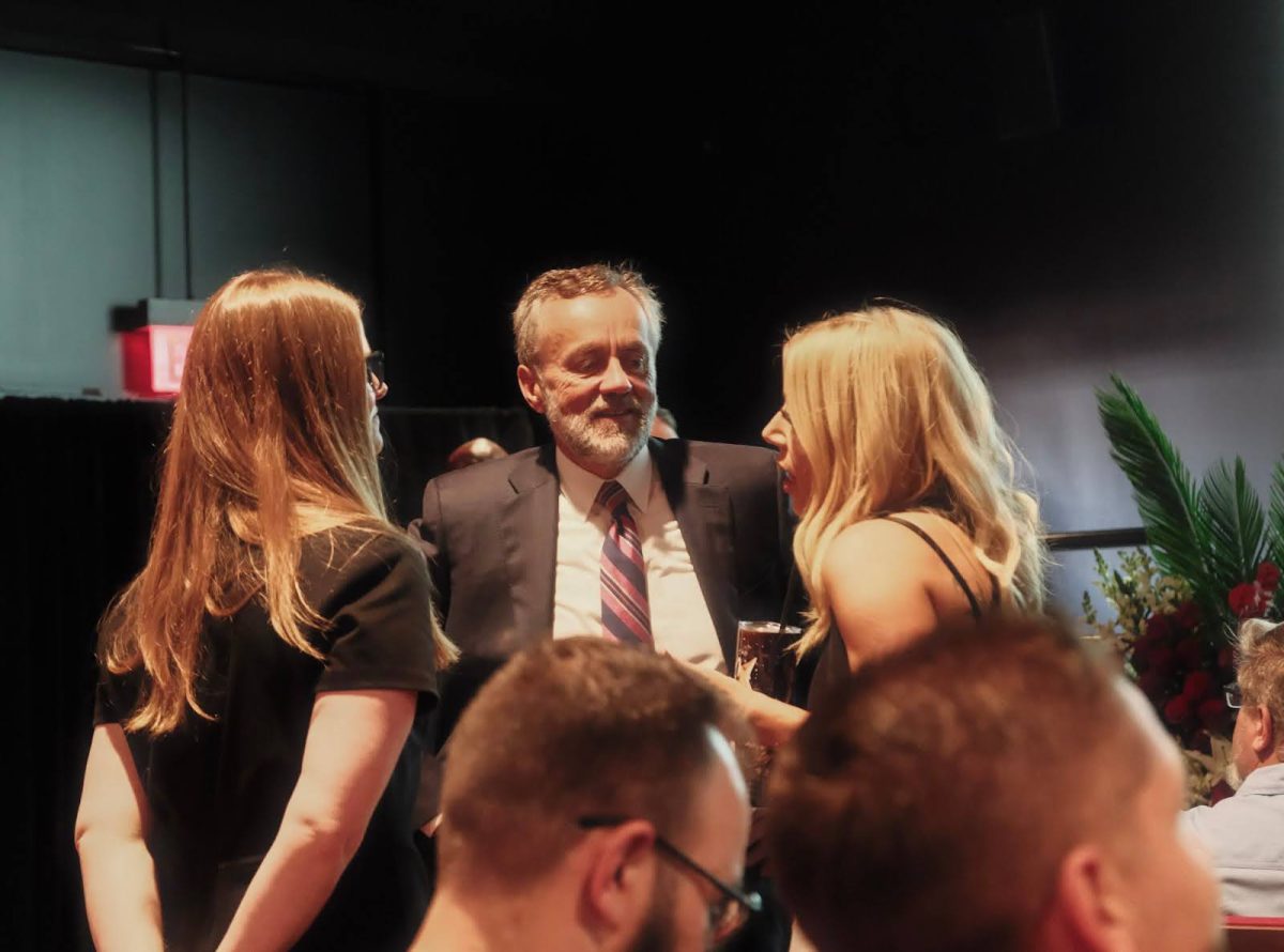 Dr. Corey talks with guests at the CMA groundbreaking ceremony