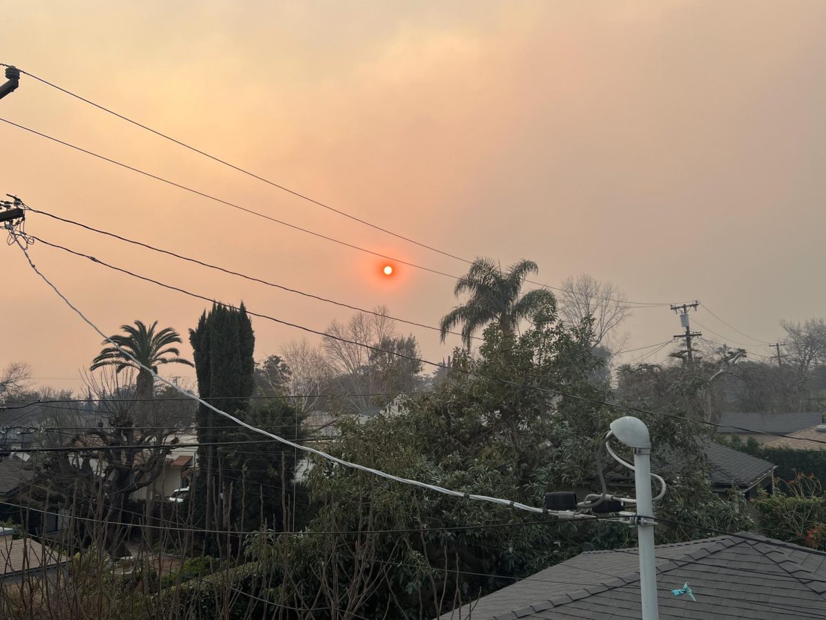 The sun shines bright red through the smoke-filled sky in Pasadena, California due to the devastating wildfires on Jan. 7, 2025.
