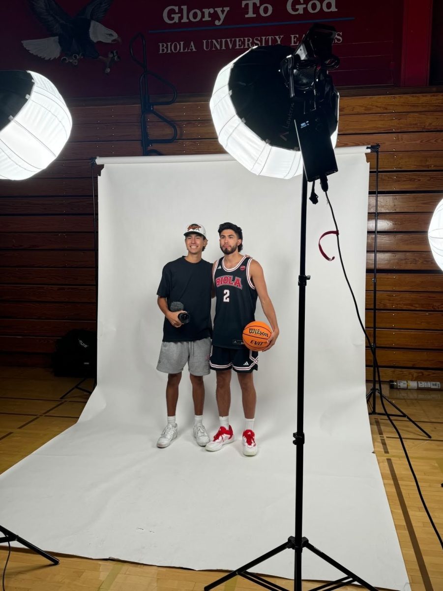 Ricky (left) and Daniel (right) Esparza posing for a photo for a sports media day.