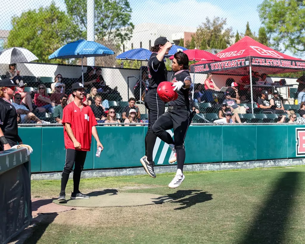 Caleb Bennet (left) and Noah Ruiz (right) jump in celebration