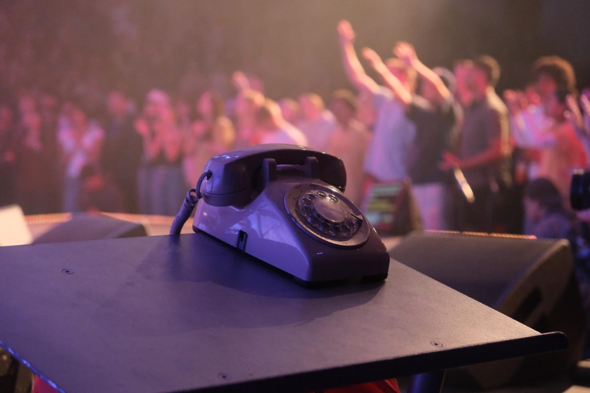 Phone prop on podium as a reminder of the "Called" Missions Conference theme